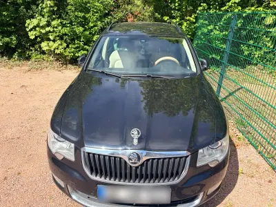 Używany Skoda Superb 163 KM (119 kW) 2011 Czarny Kombi