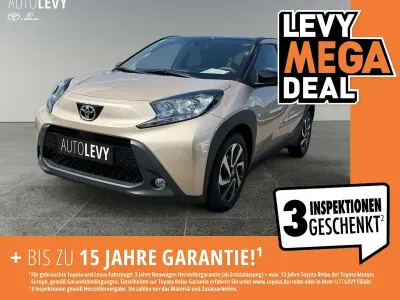 Gebraucht Toyota Aygo X Pulse 72 PS (52 kW) 2022 Ginger beige 4u9/ black mica 209 (metallic) SUV