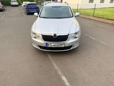 Używany Skoda Superb Ambition 140 KM (102 kW) 2013 Srebrny Kombi