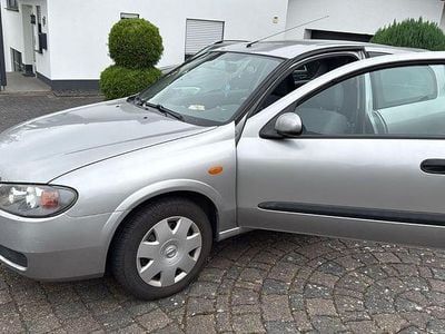 Second-hand Nissan Almera 98 CP (72 kW) 2005 Argintiu Berlinǎ