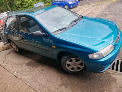 Brugt Mazda 323 88 HK (64 kW) 1997 Grøn Hatchback