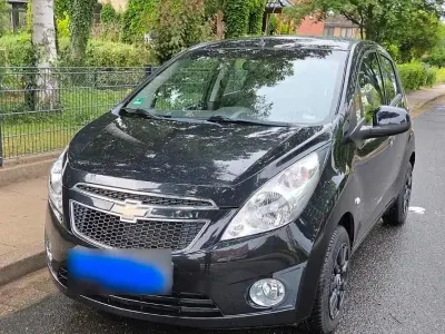 Gebraucht Chevrolet Spark 64 PS (47 kW) 2012 Schwarz Kleinwagen