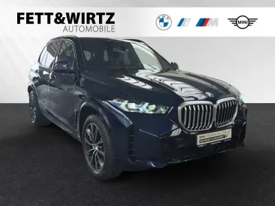 Gebraucht BMW X5 M Sport 381 PS (280 kW) 2024 Bmw individual tansanitblau metallic SUV