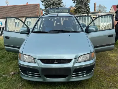 Second-hand Mitsubishi Colt 100 CP (73 kW) 2003 Albastru Hatchback