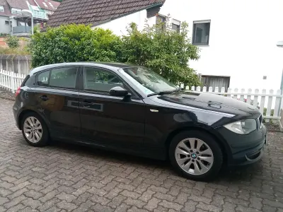 Käytetty BMW 116 122 HP (89 kW) 2009 Musta Viistoperä
