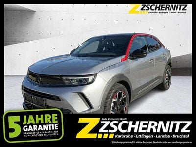 Gebraucht Opel Mokka-e GS Line 100 kW (136 PS) 2022 Kontrast grau/quarz silber SUV