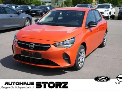 Gebraucht Opel Corsa-e Basis 100 kW (136 PS) 2022 Power orange/dynamik orange Kleinwagen