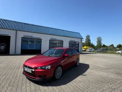 Gebraucht Mitsubishi Lancer Invite 117 PS (86 kW) 2012 Rot Limousine