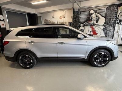 Second-hand Hyundai Grand Santa Fe Premium 197 CP (144 kW) 2014 Argintiu SUV