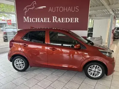Gebraucht Kia Picanto 84 PS (61 kW) 2023 (g7a) new pop orange met. Kleinwagen