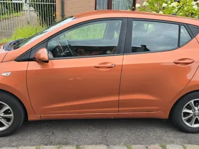 Gebraucht Hyundai i10 67 PS (49 kW) 2014 Orange Kleinwagen
