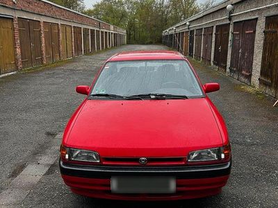 Second-hand Mazda 323 88 CP (64 kW) 1993 Roșu Berlinǎ
