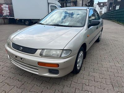 Second-hand Mazda 323 88 CP (64 kW) 1996 Auriu Berlinǎ