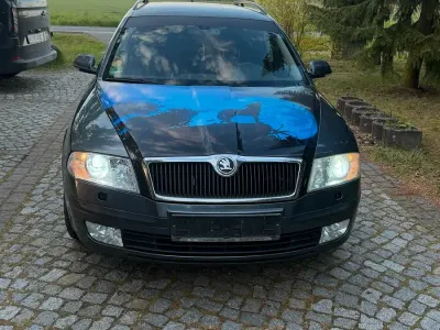 Używany Skoda Octavia 105 KM (77 kW) 2007 Szary Kombi