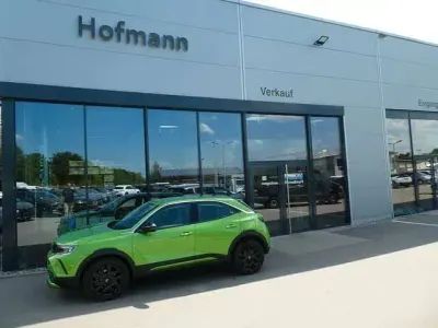 Gebraucht Opel Mokka-e Elegance 100 kW (136 PS) 2024 Grün (matcha green) SUV