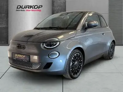 Gebraucht Fiat 500e La Prima 86 kW (118 PS) 2023 Colore esterno (mineral grau) Kleinwagen