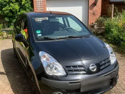 Gebraucht Nissan Pixo Acenta 68 PS (50 kW) 2009 Schwarz Kleinwagen