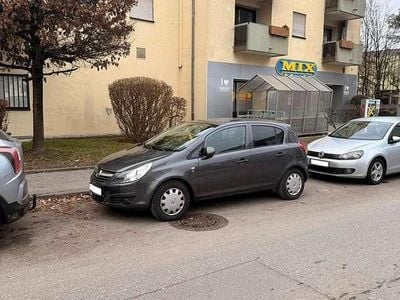 Usado Opel Corsa Edition 69 HP (50 kW) 2011 Cinzento Citadino