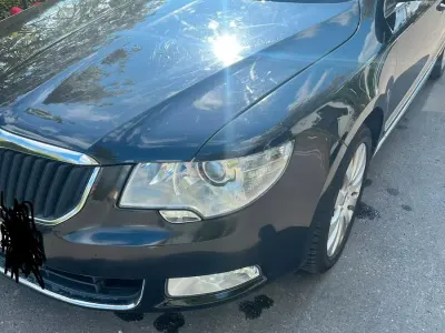 Używany Skoda Superb 160 KM (117 kW) 2012 Czarny Kombi