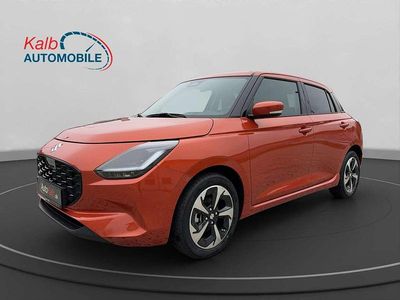 Gebraucht Suzuki Swift Comfort+ 83 PS (61 kW) 2024 Flame orange pearl metallic Kleinwagen
