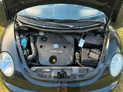 Gebraucht VW New Beetle 90 PS (66 kW) 1999 Schwarz Kleinwagen