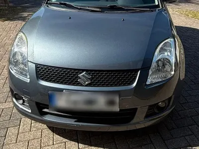Używany Suzuki Swift 92 KM (67 kW) 2010 Szary Hatchback