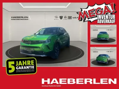 Gebraucht Opel Mokka Elegance 101 PS (74 kW) 2023 Matcha green/ikone gruen (metallic) SUV