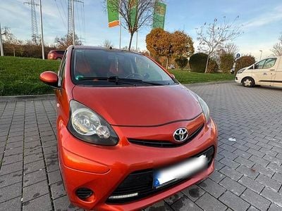 Gebraucht Toyota Aygo 68 PS (50 kW) 2013 Orange Kleinwagen