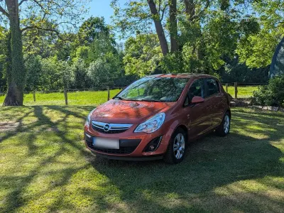 Gebraucht Opel Corsa Active 87 PS (63 kW) 2013 Rot Kleinwagen