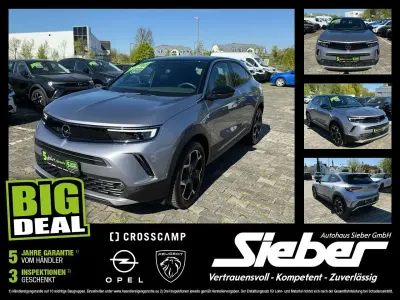 Gebraucht Opel Mokka Ultimate 131 PS (96 kW) 2023 Kontrast grau/quarz silber SUV