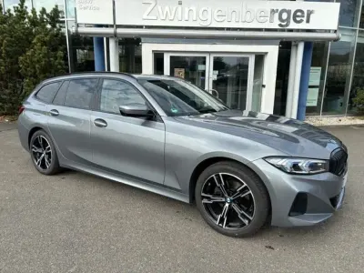Gebraucht BMW 320e Sport Line 190 PS (139 kW) 2023 Skyscraper grau metallic Kombi