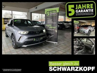 Gebraucht Opel Mokka-e Ultimate 100 kW (136 PS) 2022 Kontrast grau/quarz silber SUV
