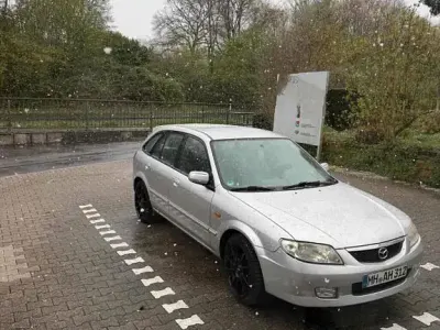Używany Mazda 323 72 KM (52 kW) 2002 Szary Sedan/Limuzyna