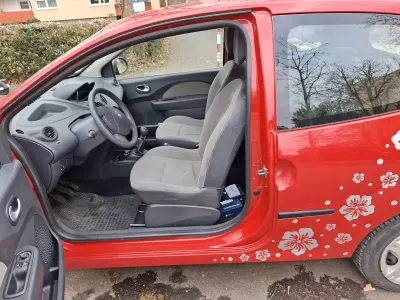 Second-hand Renault Twingo 58 CP (42 kW) 2009 Roșu Hatchback