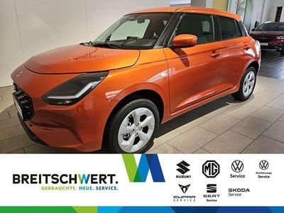 Flame orange pearl metallic Gebraucht 2024 Suzuki Swift Comfort Kleinwagen | 18.450 € (Fairer Preis)