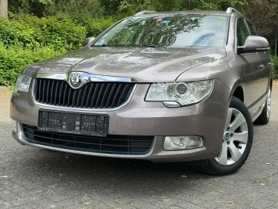 Używany Skoda Superb Elegance 125 KM (91 kW) 2012 Purpurowy Kombi