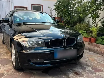 Gebraucht BMW 116 122 PS (89 kW) 2010 Schwarz Kleinwagen