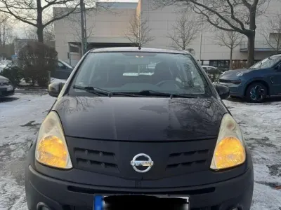Gebraucht Nissan Pixo 68 PS (50 kW) 2011 Schwarz Kleinwagen