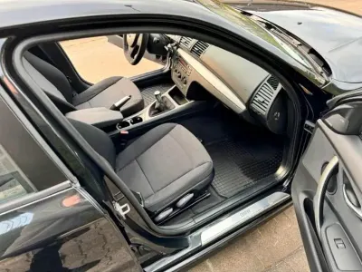 Gebraucht BMW 116 122 PS (89 kW) 2010 Schwarz Kleinwagen
