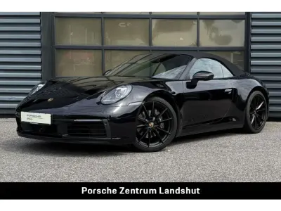 Gebraucht Porsche 992 385 PS (283 kW) 2023 Tiefschwarzmetallic (metallic) Cabrio