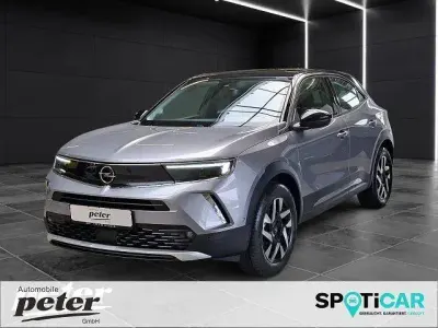 Gebraucht Opel Mokka-e Elegance 100 kW (136 PS) 2022 Kontrast grau/quarz silber SUV