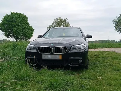 Gebraucht BMW 520 184 PS (135 kW) 2011 Schwarz Kombi