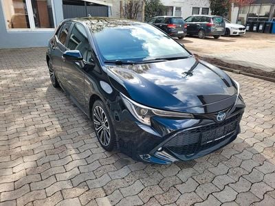 Gebraucht Toyota Corolla Hybrid Club 122 PS (89 kW) 2019 Black mica / ink Kleinwagen