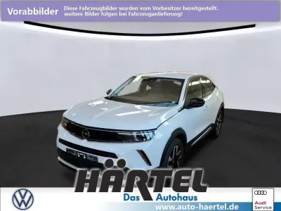 Gebraucht Opel Mokka-e Elegance 100 kW (136 PS) 2022 Jade weiß (white), metallic SUV