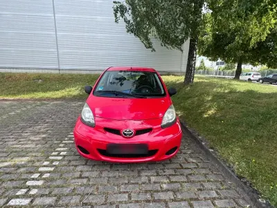 Gebraucht Toyota Aygo 68 PS (50 kW) 2009 Rot Kleinwagen