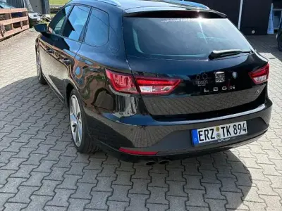 Używany Seat Leon ST FR 179 KM (131 kW) 2014 Czarny Kombi