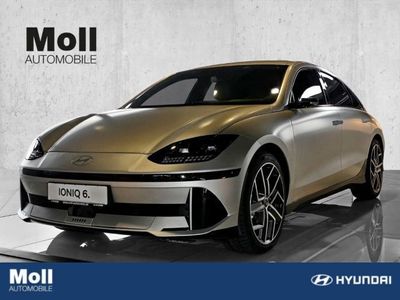 gebraucht Hyundai Ioniq 77kWh 4WD Unique-Paket Matt Gold Dig. Außenspiegel