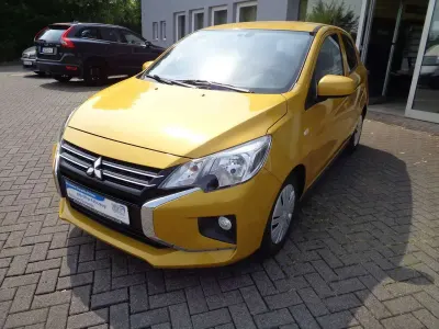 Gebraucht Mitsubishi Space Star Spirit 71 PS (52 kW) 2021 Citringelb (m) Kleinwagen