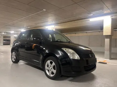 Używany Suzuki Swift 94 KM (69 kW) 2010 Czarny Hatchback
