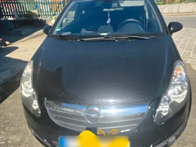 Używany Opel Corsa 90 KM (66 kW) 2009 Czarny Hatchback